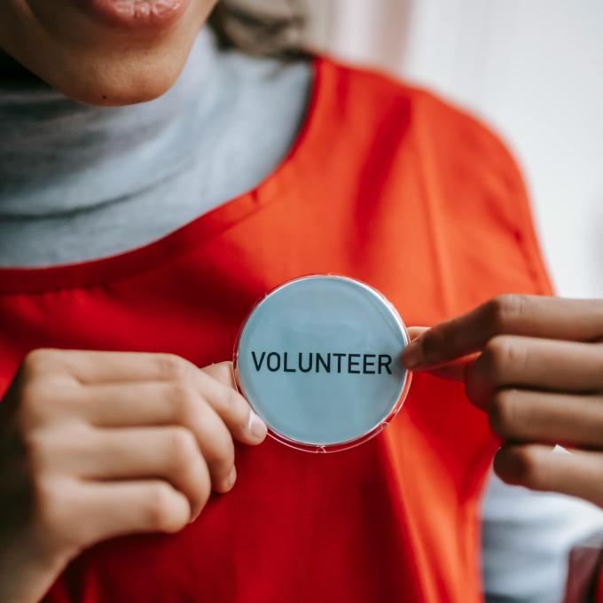 Volunteer wearing volunteer button