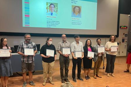 eight faculty holding awards